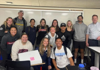 ENS Students posing for photo in classroom